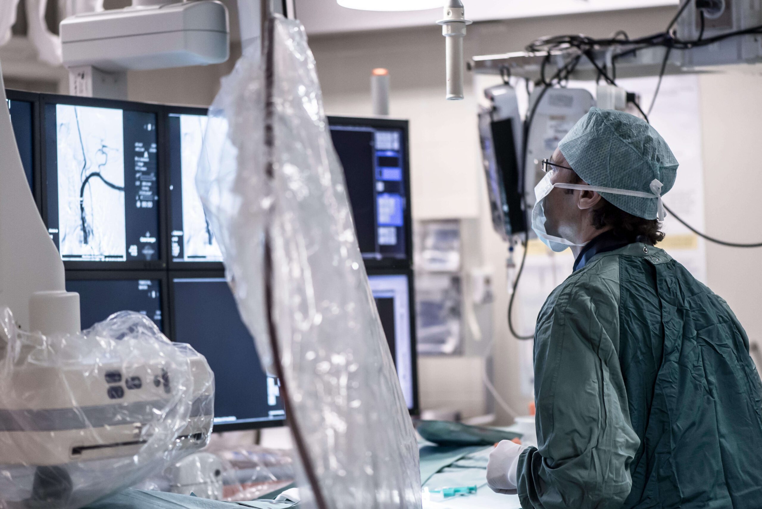 A clinician working on endovascular deep brain stimulation.